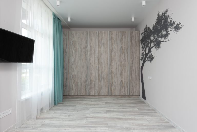 Light gray wood-look luxury vinyl plank flooring in an empty Tennessee room